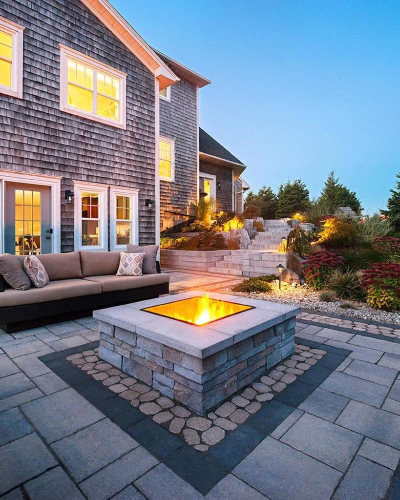 traditional fire pit in the landscaping as an outdoor fire feature