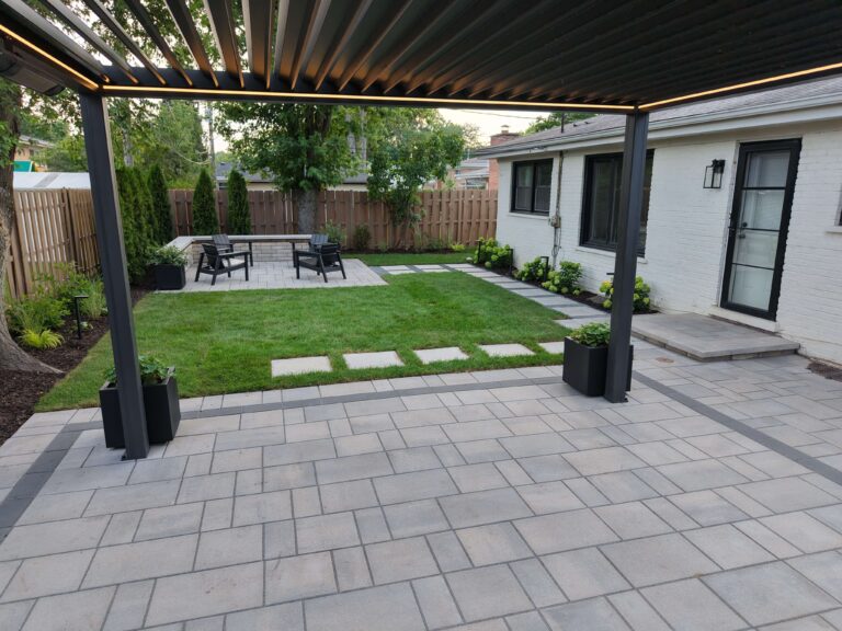 Paver patio with modern pergola and backyard hardscaping in Cicero, IL by Luxterra Outdoors