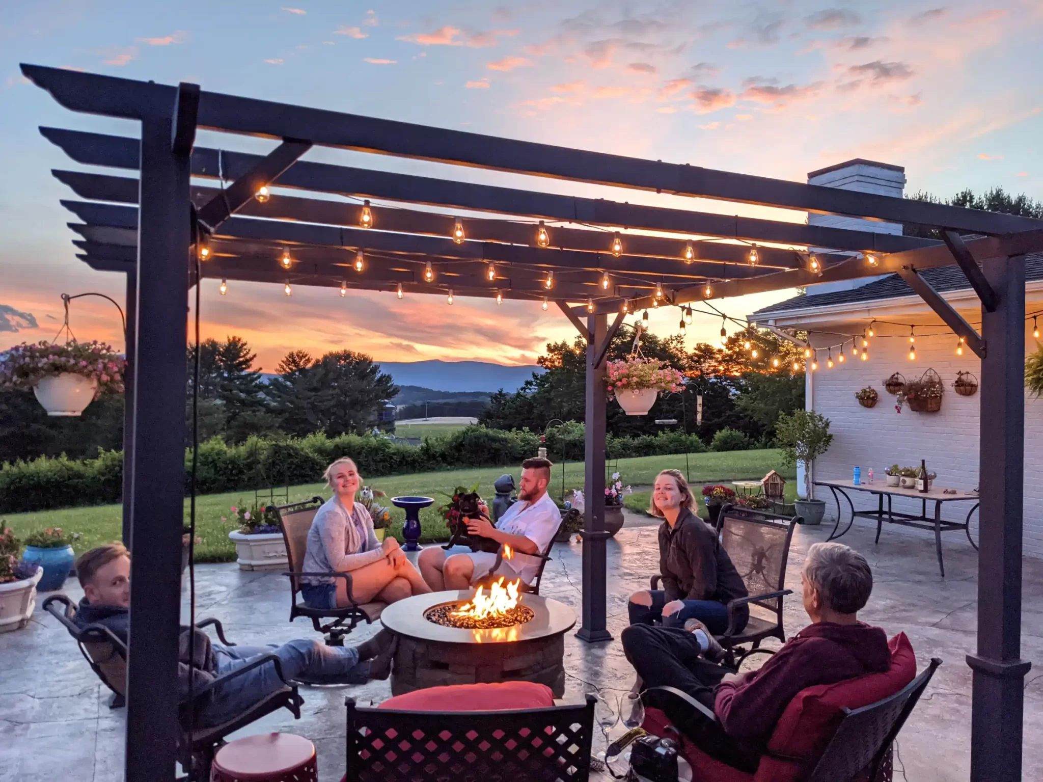 a family relaxing around a fire table in outdoor s 2025 03 11 18 30 57 utc 1 1x 2048x1535 1